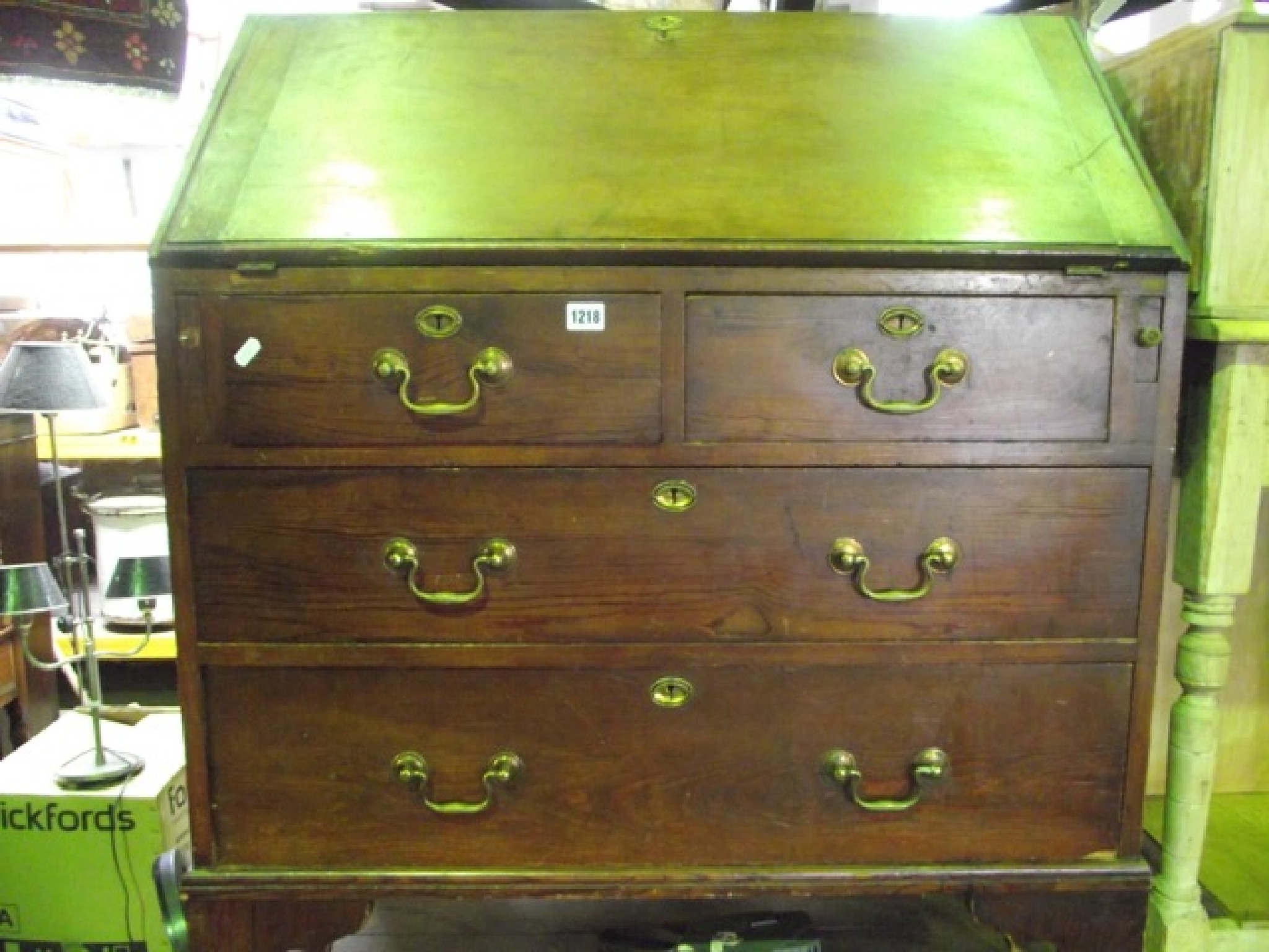 Appraisal: A th century pitch pine bureau the fall flap enclosing