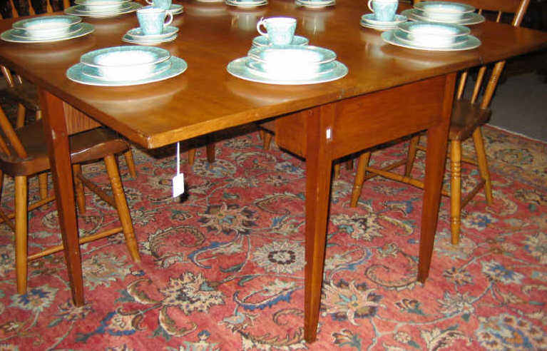 Appraisal: AMERICAN TH CENTURY CHERRY DROP LEAF TABLE Plain rectangular top