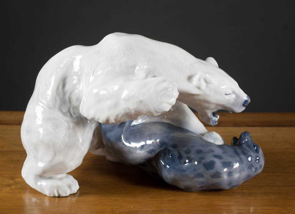 Appraisal: ROYAL COPENHAGEN PORCELAIN WILDLIFE SCULPTURE depicting a polar bear attacking