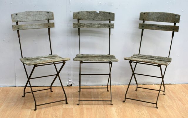 Appraisal: Three French folding iron and timber cafe chairs