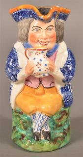 Appraisal: Staffordshire China Toby Jug Polychrome decorated with blue willow jacket