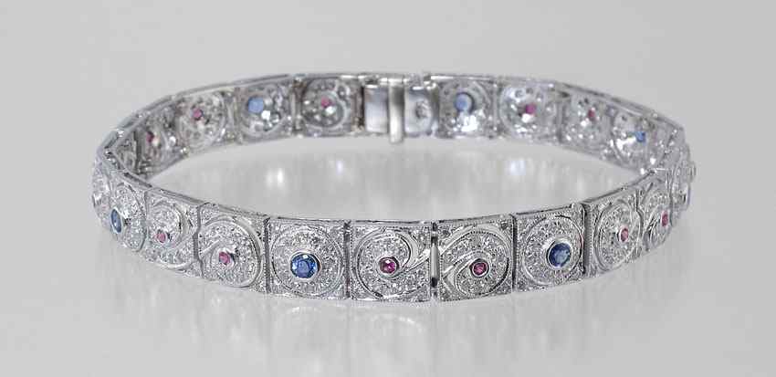 Appraisal: CTW DIAMOND RUBY SAPPHIRE BRACELET K white gold bracelet contains