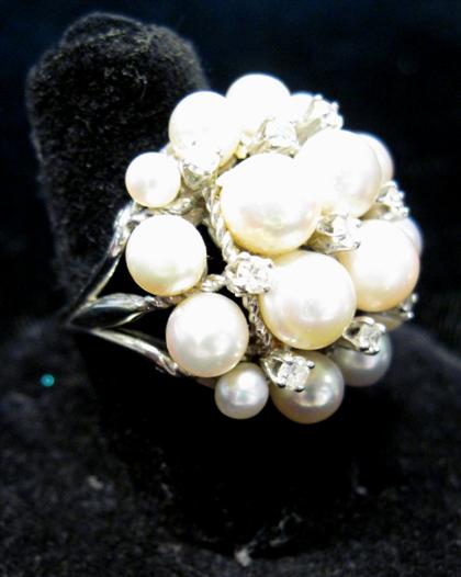 Appraisal: karat white gold pearl and diamond ringCluster ring displaying cream