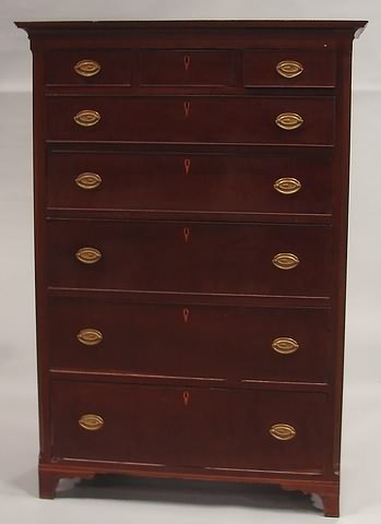 Appraisal: Cherry with three over five cockbeaded graduated drawers and flanked