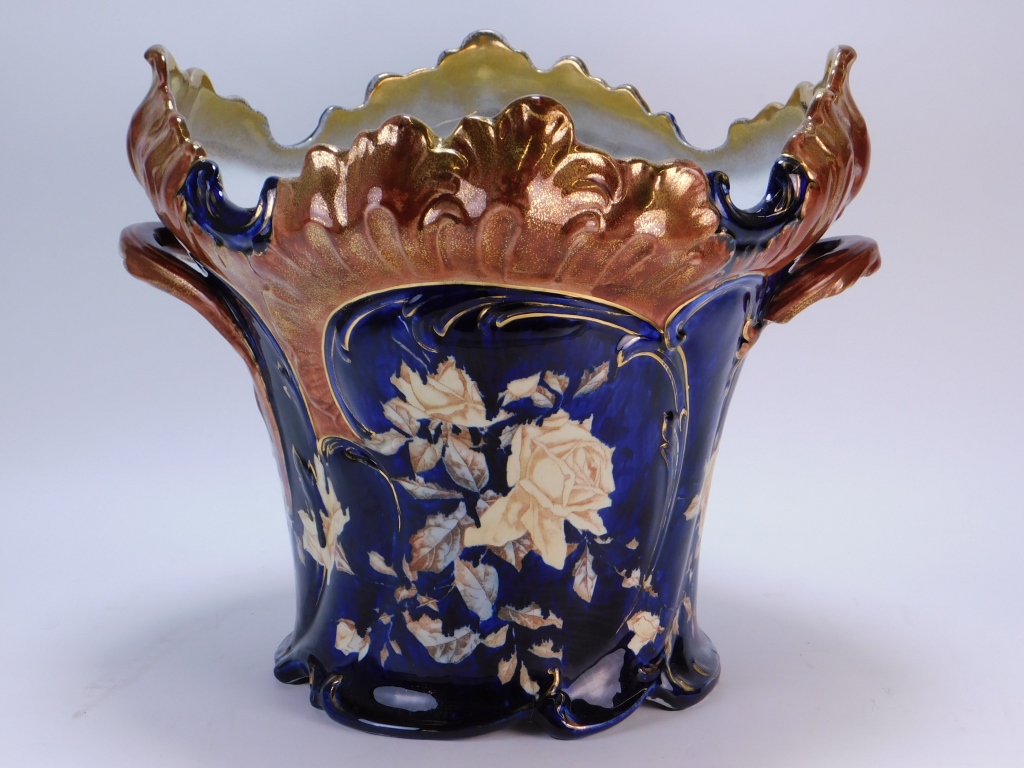 Appraisal: LG EUROPEAN COBALT BLUE FLORAL JARDINIERE Europe th CenturyShapely jardiniere