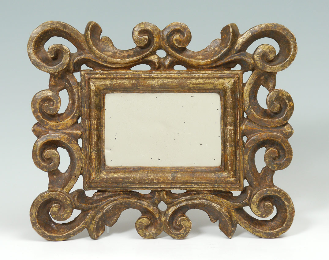 Appraisal: SMALL CARVED CONTINENTAL WALL MIRROR Carved and gilt decorated with