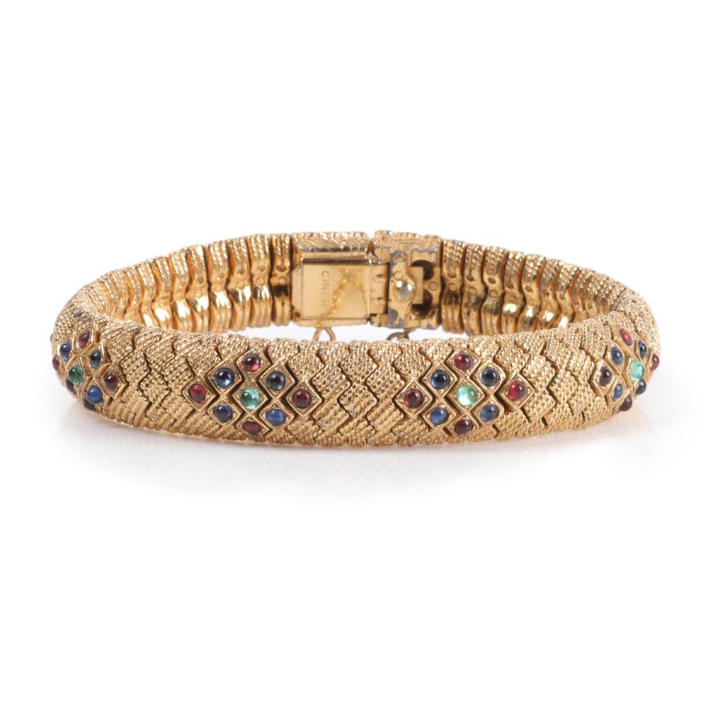 Appraisal: Ciner brushed gold snakeskin bracelet with jewel tone cabochon accents