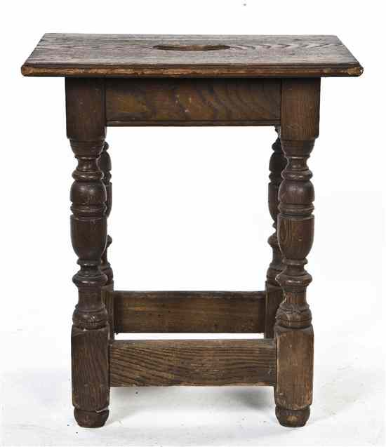 Appraisal: A Jacobean Oak Revival Stool having a rectangular handled top