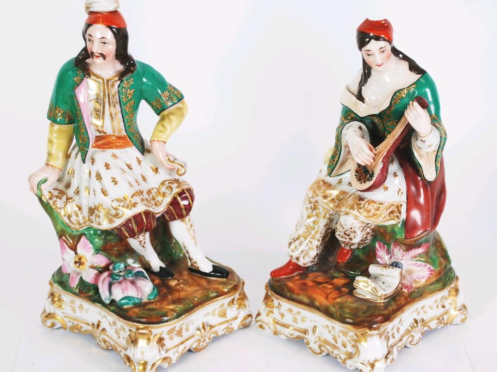 Appraisal: PAIR OF NINETEENTH CENTURY CONTINENTAL PORCELAIN FIGURAL FLASKS seated man