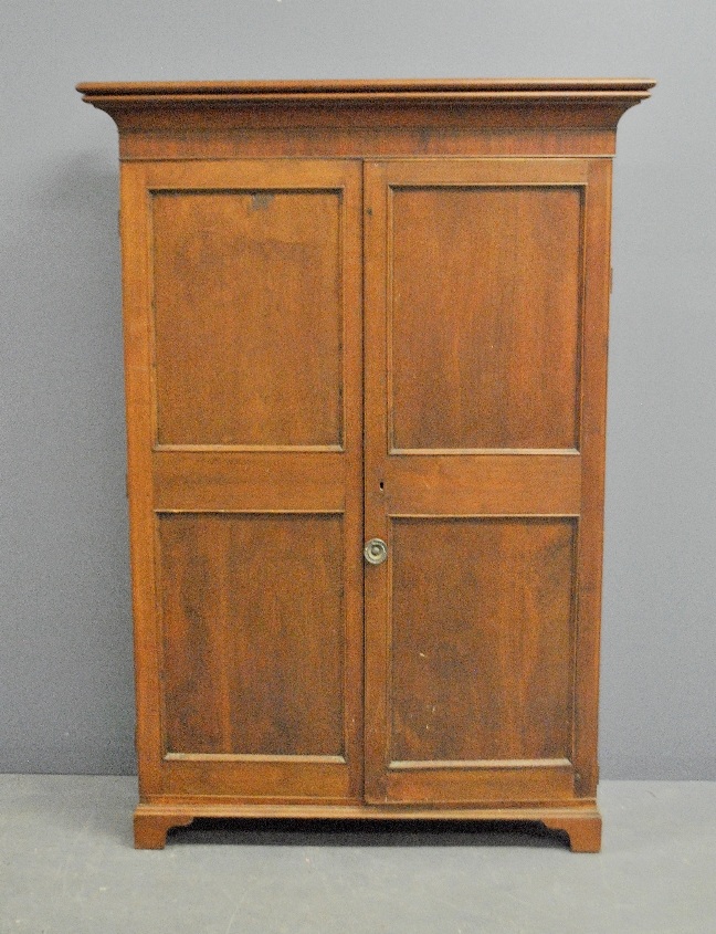 Appraisal: - Mahogany blind door cabinet th c with shelved interior