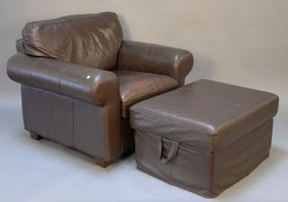 Appraisal: Large brown leather chair and ottoman Large brown leather chair