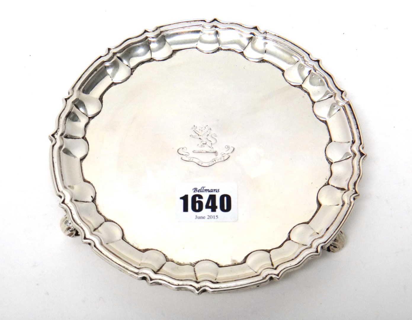 Appraisal: A silver waiter of shaped circular form with a Chippendale