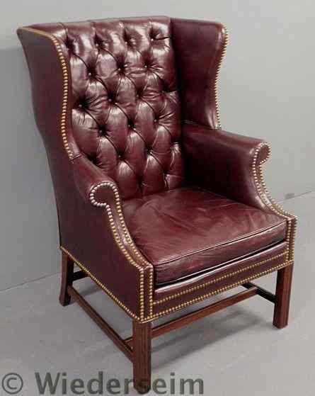 Appraisal: Chippendale style mahogany leather wingchair by Southwood h x w