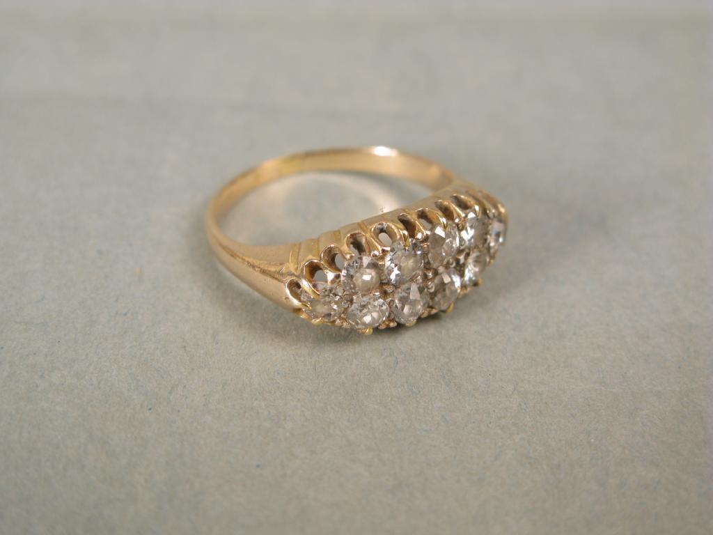 Appraisal: A gold and diamond ring ten stones in claw setting