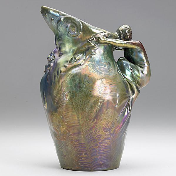 Appraisal: DELPHIN MASSIERPitcher with bearded figure and peacock feathers lustrous glazeA