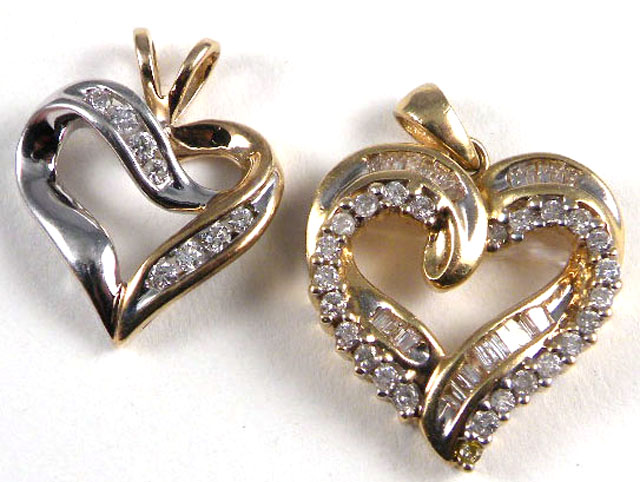 Appraisal: TWO DIAMOND HEART PENDANTS one k yellow and white gold