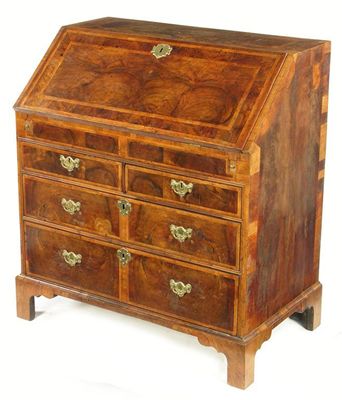 Appraisal: A George II walnut bureau with feather banding the hinged