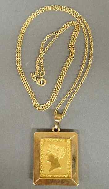 Appraisal: Postage pendant with chain gold rectangular Postage One Penny commemorative