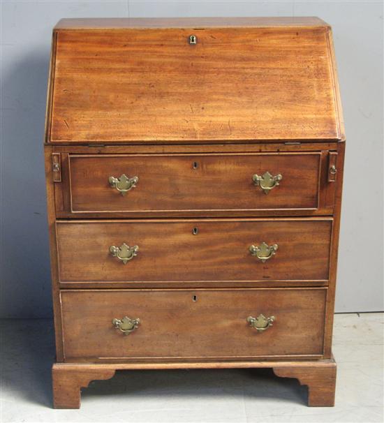 Appraisal: George III mahogany bureau the interior with pigeon holes and