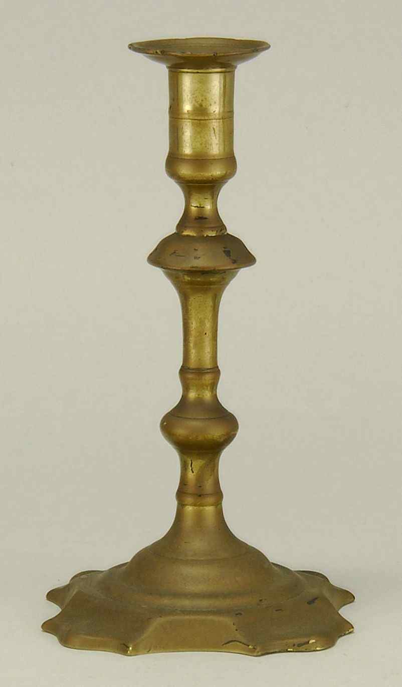 Appraisal: ANTIQUE BRASS CANDLESTICK th CenturyWith quatrefoil base Height Provenance From