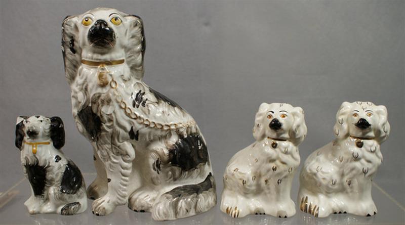 Appraisal: Staffordshire black white spaniels on figures craquelure some chips tallest