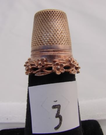 Appraisal: German sterling thimble with floral band