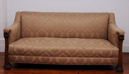 Appraisal: AMERICAN ART NOUVEAU CARVED OAK SOFA The rectangular padded back