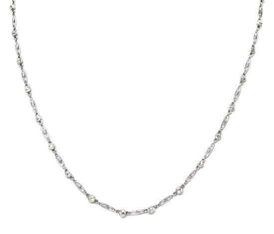 Appraisal: An Edwardian Platinum and Diamond Filigree Necklace containing bezel set