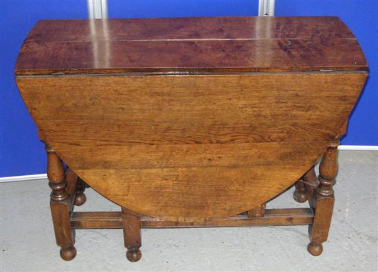 Appraisal: Oak drop leaf table th century with single drawer on