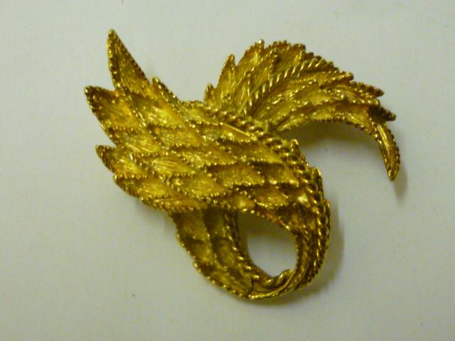 Appraisal: A BOUCHERON CT GOLD BROOCH modelled as a pair of