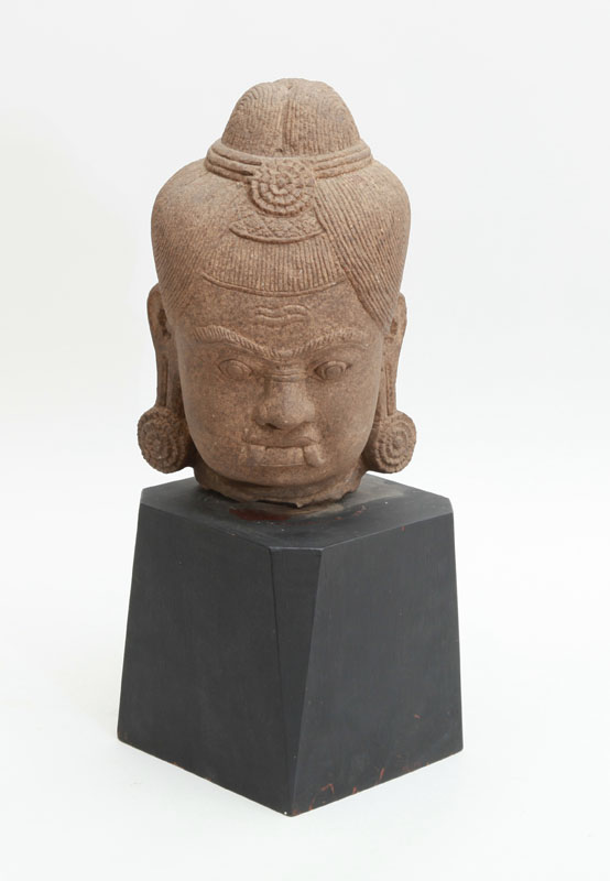 Appraisal: INDIAN CARVED STONE BUST OF A BUDDHA Raised on an