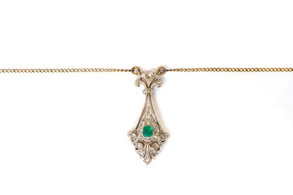 Appraisal: A gold and platinum emerald and rose diamond set pendant