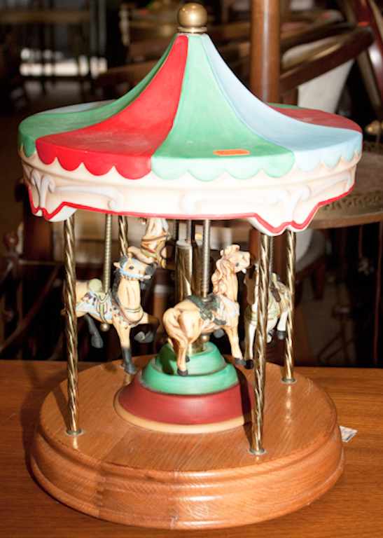 Appraisal: Carousel music box with painted bisque horses Estimate - All