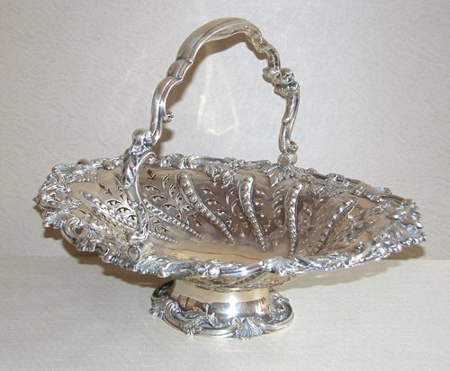 Appraisal: Artist Title Sheffield repousse and pierced silverplate footed cake basket