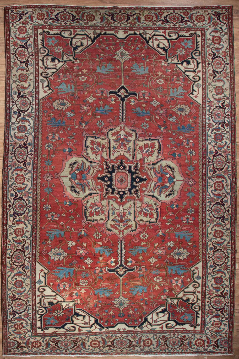 Appraisal: Antique Serapi Carpet red ground central medallion spandrels stylized floral