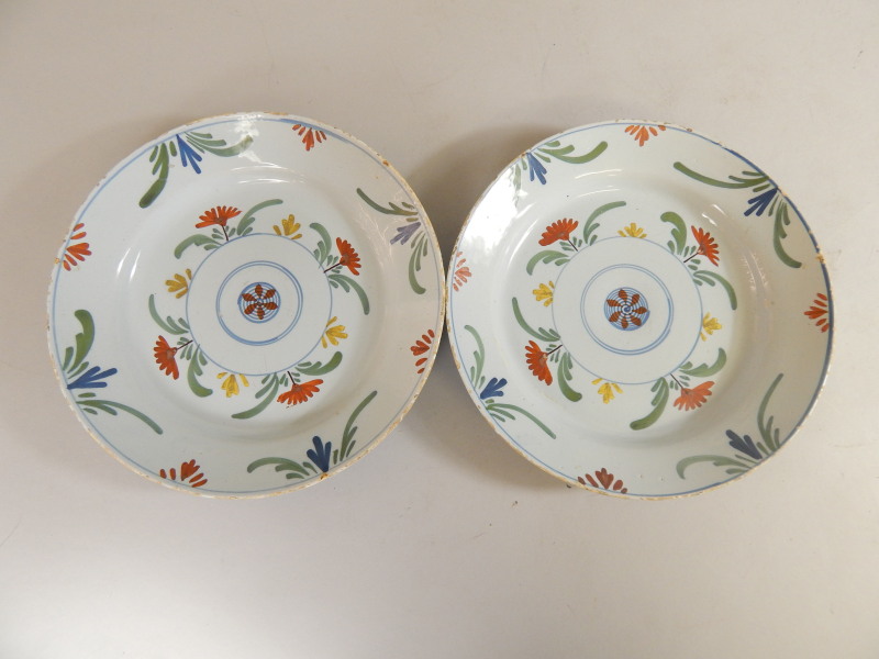 Appraisal: A pair of late th early thC Delft polychrome plates