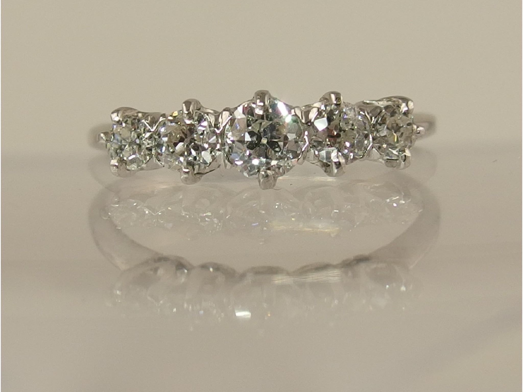 Appraisal: A white metal mounted five stone old cut diamond ring