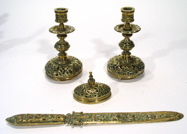 Appraisal: Pair of heavy pierced brass candlesticks matching page turner and