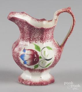 Appraisal: Red spatter creamer with tulip decoration '' h