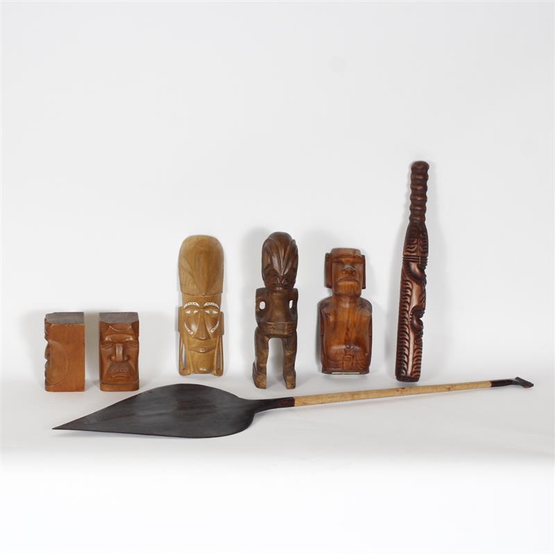 Appraisal: Seven carved wooden ethnographic pieces Alaskan figural bookends and Polynesian