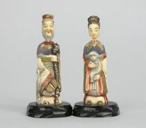 Appraisal: A Pair of Figurative Snuff Bottles Carved and stained ivory