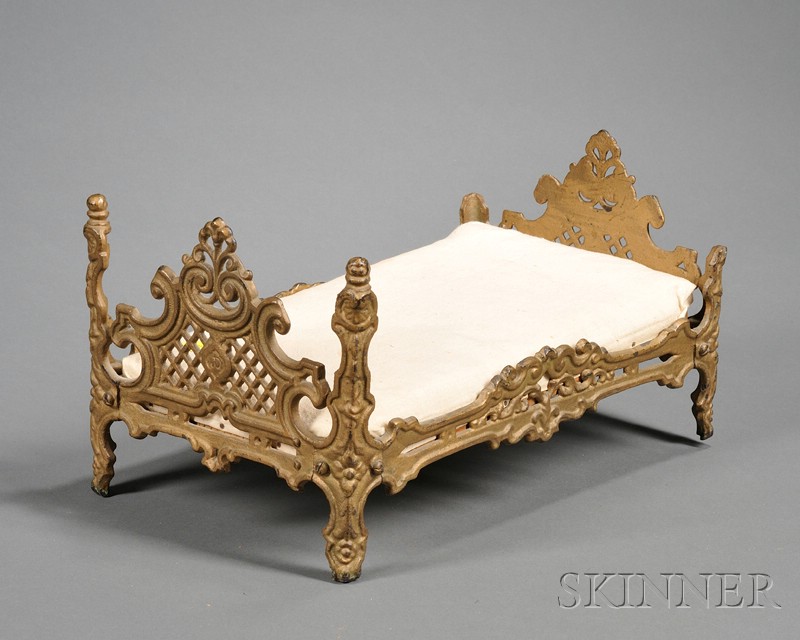 Appraisal: Gold-painted Cast Iron Victorian Doll Bed mid- th century fancy