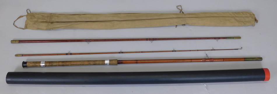 Appraisal: A three piece fibre glass fishing rod in cloth carrier