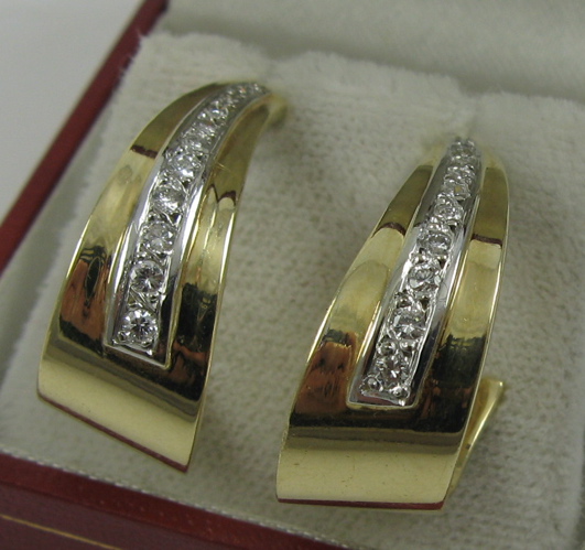 Appraisal: PAIR OF DIAMOND AND FOURTEEN KARAT GOLD EARRINGS each is