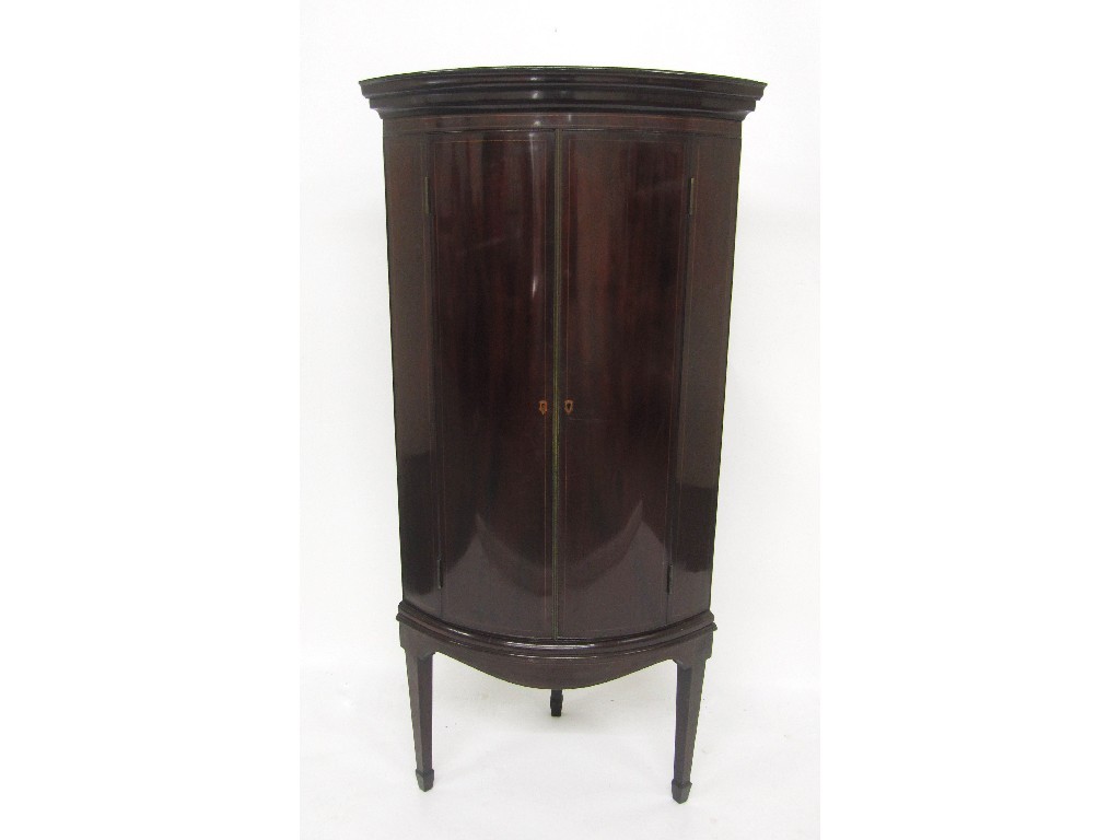 Appraisal: An Edwardian mahogany inlaid corner cupboard the Georgian style cupboard