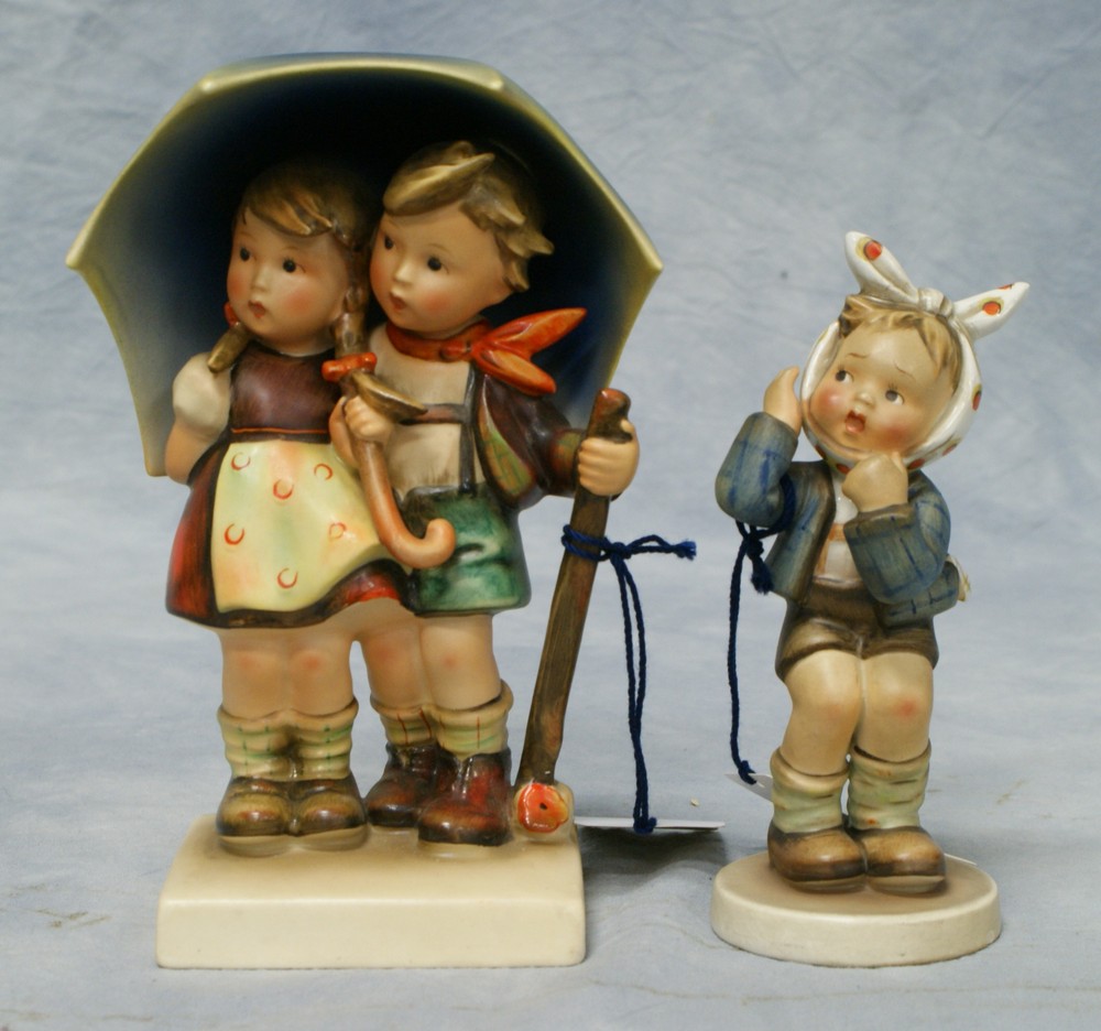 Appraisal: Hummel figurines Stormy Weather Hum Boy with Toothache Hum TMK-