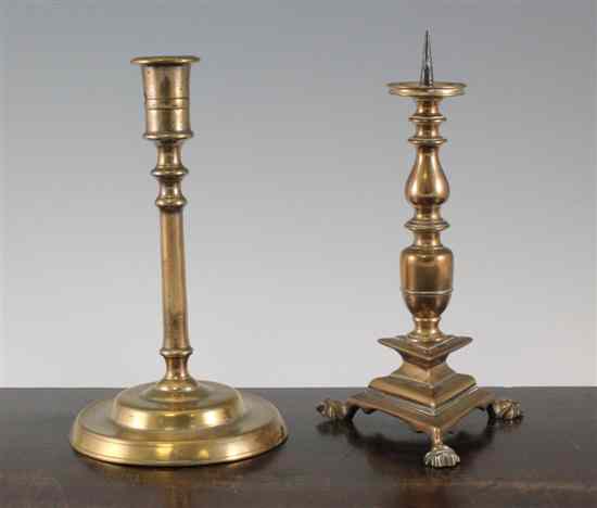 Appraisal: A th century bell metal pricket candlestick on triangular base