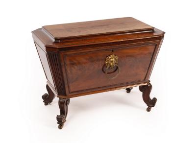 Appraisal: A Regency mahogany sarcophagus-shaped wine cooler with reeded canted sides