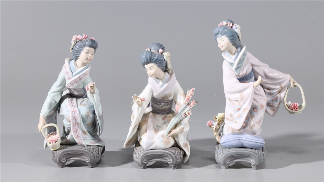 Appraisal: Group of three Lladro porcelain geisha figures with flowers overall