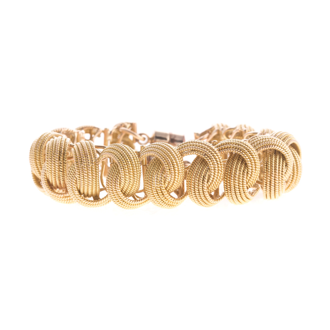 Appraisal: A K Textured Interlocking Braided Bracelet K yellow gold wide